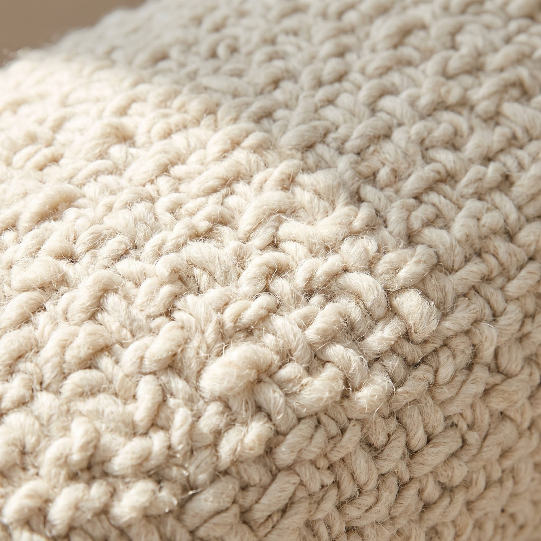 Close-up of looped ivory bouclé upholstery fabric