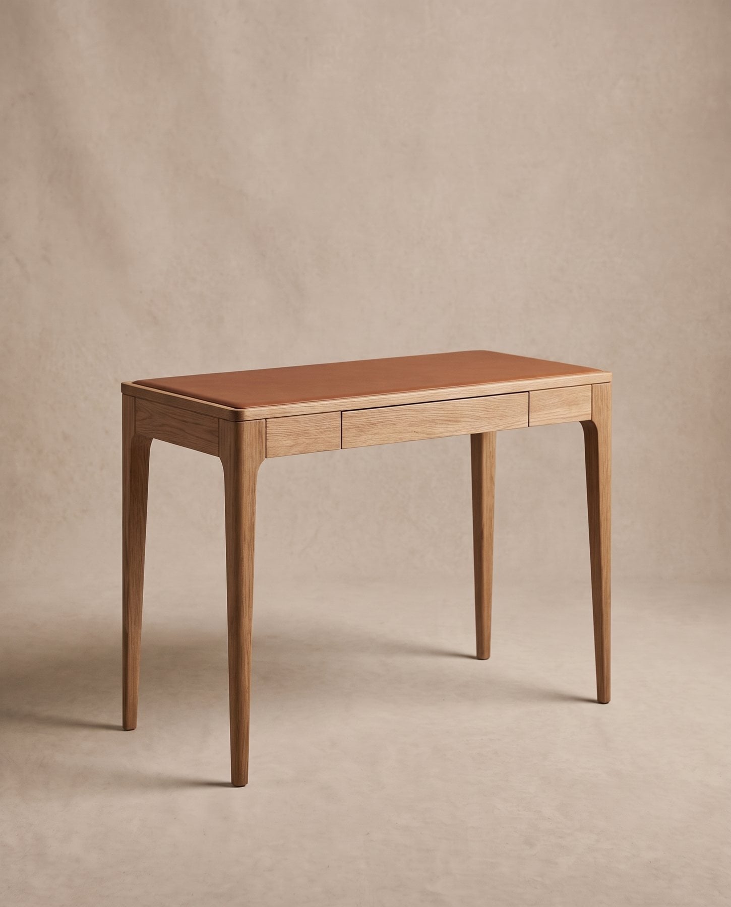 Scriba writing desk in natural oak with a cognac leather inset top and a shallow drawer